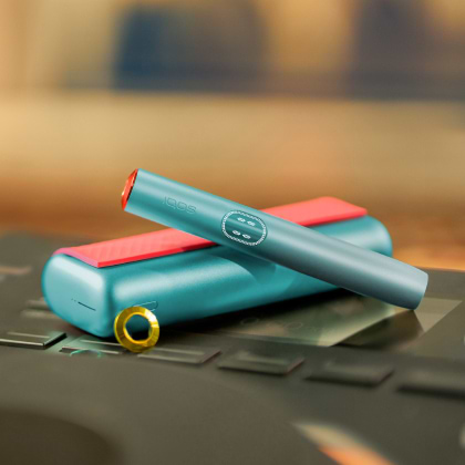 An IQOS ILUMA PRIME Holder and Pocket Charger in a box.