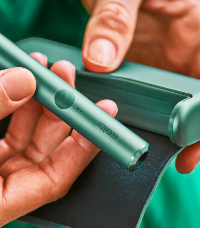 A woman holding travel documents.