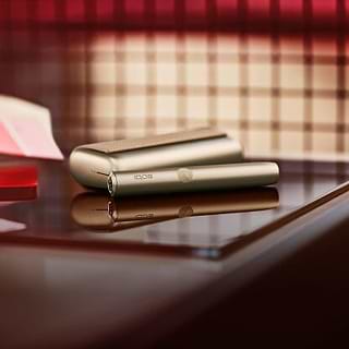 An obsidian black IQOS ILUMA device.