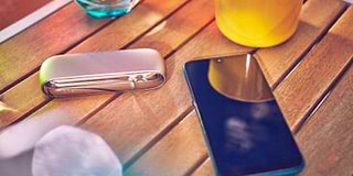 Girl unpacking her IQOS device