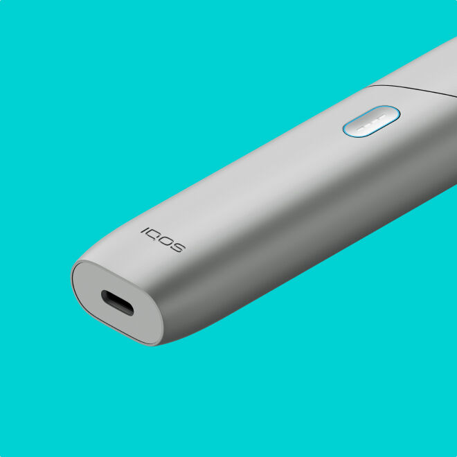 Silver IQOS Originals ONE heated tobacco device.	 	