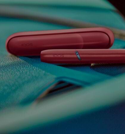 IQOS Originals Duo holder and pocket charger in red color.	 	